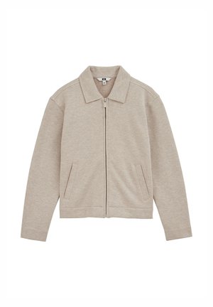 Hellbeige Jacke mit Reißverschluss, Kragen, zwei Fronttaschen und strukturierter Textur. Verfügt über eine lockere Passform und gerippte Bündchen.