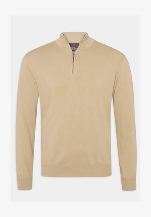 Beige puolivetoketjullinen neulepusero, joka on valmistettu pehmeästä neuloksesta. Puserossa on korkea kaulus ja pitkät hihat, joissa on joustavat hihansuut ja helma.