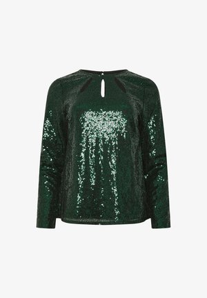 Vihreä paljetein koristeltu pitkähihainen yläosa, jossa on avonainen selkäosa, sisältää teksturoitua kangasta ja istuvan muotoilun, kimaltava valon alla.