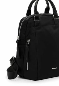Black bag made of smooth nylon, featuring zippered compartments, dual top handles, and a detachable shoulder strap. Silver hardware accents.