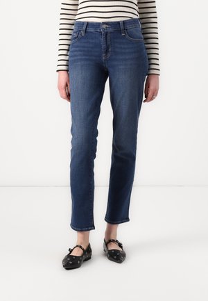 Jeans in denim blu scuro con vestibilità dritta e leggere pieghe. Presentano un classico design a cinque tasche e cuciture in contrasto.