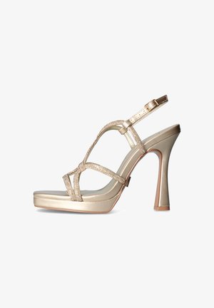 Sandalo dorato con tacco alto, sottili cinturini scintillanti, fibbia posteriore e suola piattaforma leggermente rialzata.