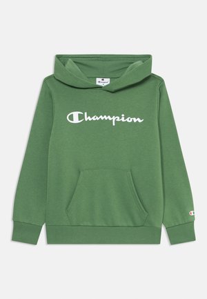 Zeleni bombažni hooded pulover z žepom, rebrastimi manžetami in belim logotipom "Champion" na sprednji strani. Enostaven, sproščen dizajn.