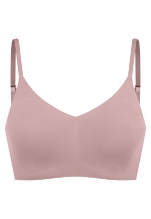 Wireless bra in soft pink material with a smooth texture. Features adjustable straps and a v-shaped neckline design. No patterns or hardware.