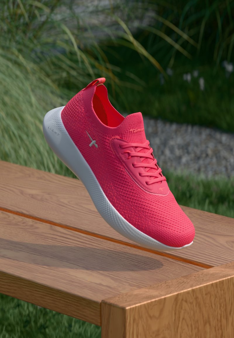 Ροζ slip-on αθλητικά παπούτσια με υφασμάτινη υφή στην επάνω επιφάνεια, λευκή σόλα και διακριτική σήμανση. Διαθέτουν στρογγυλό άκρο και αντίθετα περιγράμματα.