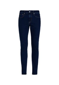 Úzké džíny v tmavě modrém denimu, s klasickým pětikapsovým designem, zapínáním na knoflík a kontrastním prošitím na švech.