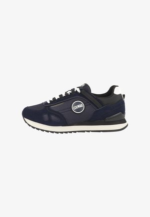 Navy blue and black low-top sneaker with white laces, COLMAR logo on side, mesh and suede panels, and white and black sole.