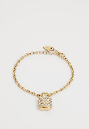 Bracciale in catena d'oro con un charm a forma di lucchetto decorato con scintillanti strass. Il lucchetto ha una forma cilindrica e una superficie testurizzata.