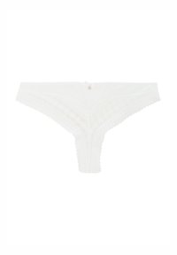String en dentelle blanche avec un bord motif et un petit accent métallique décoratif à la taille. Texture douce et délicate.