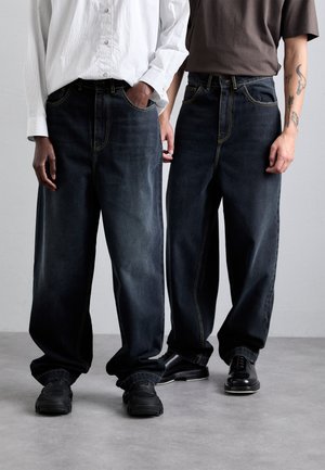 UNISEX - Relaxed fit jeans - black