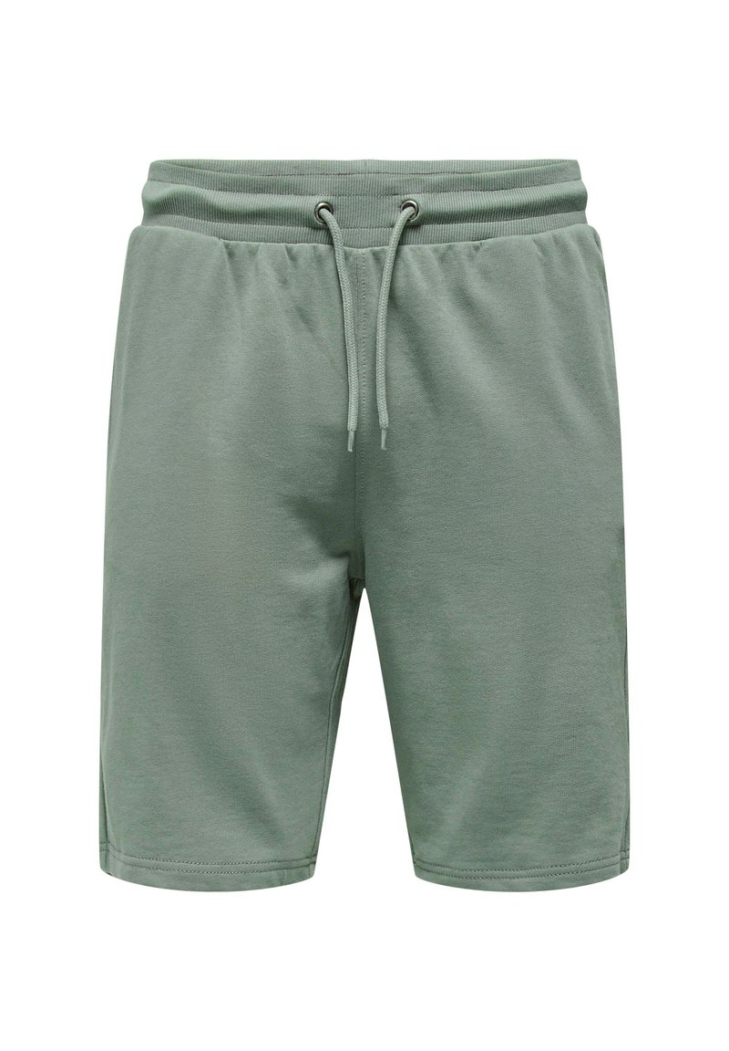 Pantalones cortos de algodón verde claro con cintura elástica, cierre de cordón y aberturas laterales para facilitar el movimiento. Textura suave, diseño casual.