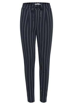 Pantalon rayé navy avec cordon de serrage à la taille, ornés de rayures blanches verticales. Conçu avec une coupe fuselée et une texture lisse.