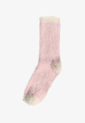 Hyggelig pink sok med en blød tekstur, der har en cremede manchet og tådetaljer, som giver varme og komfort.