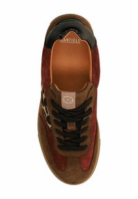 Brown and maroon suede sneaker with black accents, leopard print detail on the side, flat black laces, and a rounded toe design.