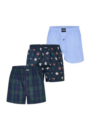 Caleçons pour hommes en trois styles : à carreaux bleus, en bleu clair uni et en bleu marine avec des motifs de Noël, disposés de manière superposée.
