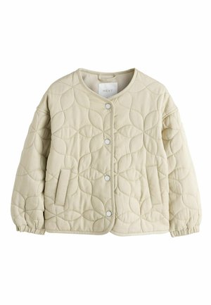 Quiltet beige jakke med rund hals, trykknapper, elastiske manchetter og en sidelomme. Har et tekstureret, cirkulært mønster.