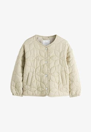 Béžinė siuvinėta striukė su apvaliu iškirpimu, spaudėmis, elastinėmis rankovėmis ir šoniniu kišeniu. Pasižymi tekstūruotu, apvaliu raštu.