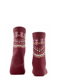 I calzini bordeaux presentano un motivo lavorato a maglia con fiori, diamanti e cerchi nei colori rosa, bianco e arancione, con polsini a costine per una maggiore texture.