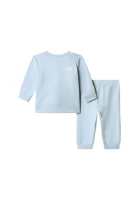 Light blue sweatshirt and matching pants made of soft, smooth fabric. Features a small logo on the chest and elastic cuffs at the wrists and ankles.