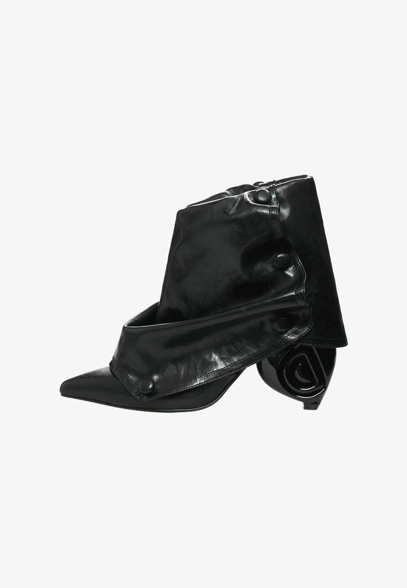 Black leather ankle boot with a pointed toe, featuring a fold-over design and button accents. Curved, glossy heel with unique shape.