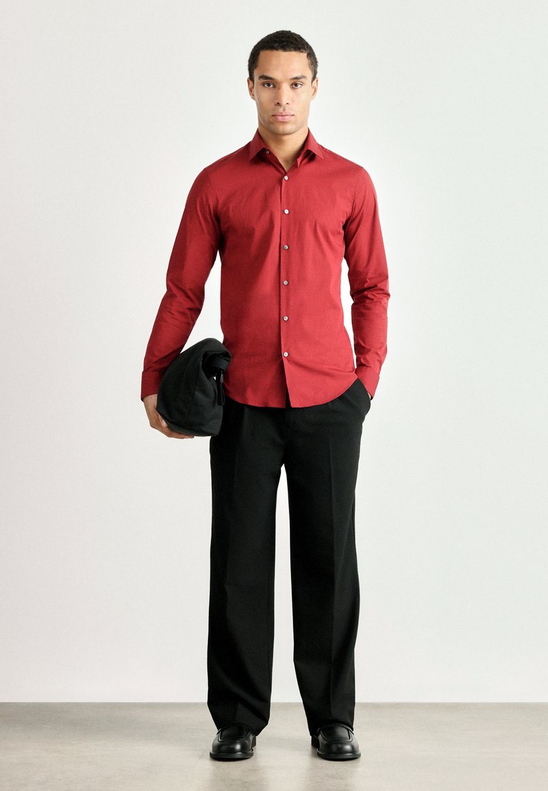red dress shirt with black pants Long Sleeve Pleated Smocked Button Down | Red Camellia | L main image 0