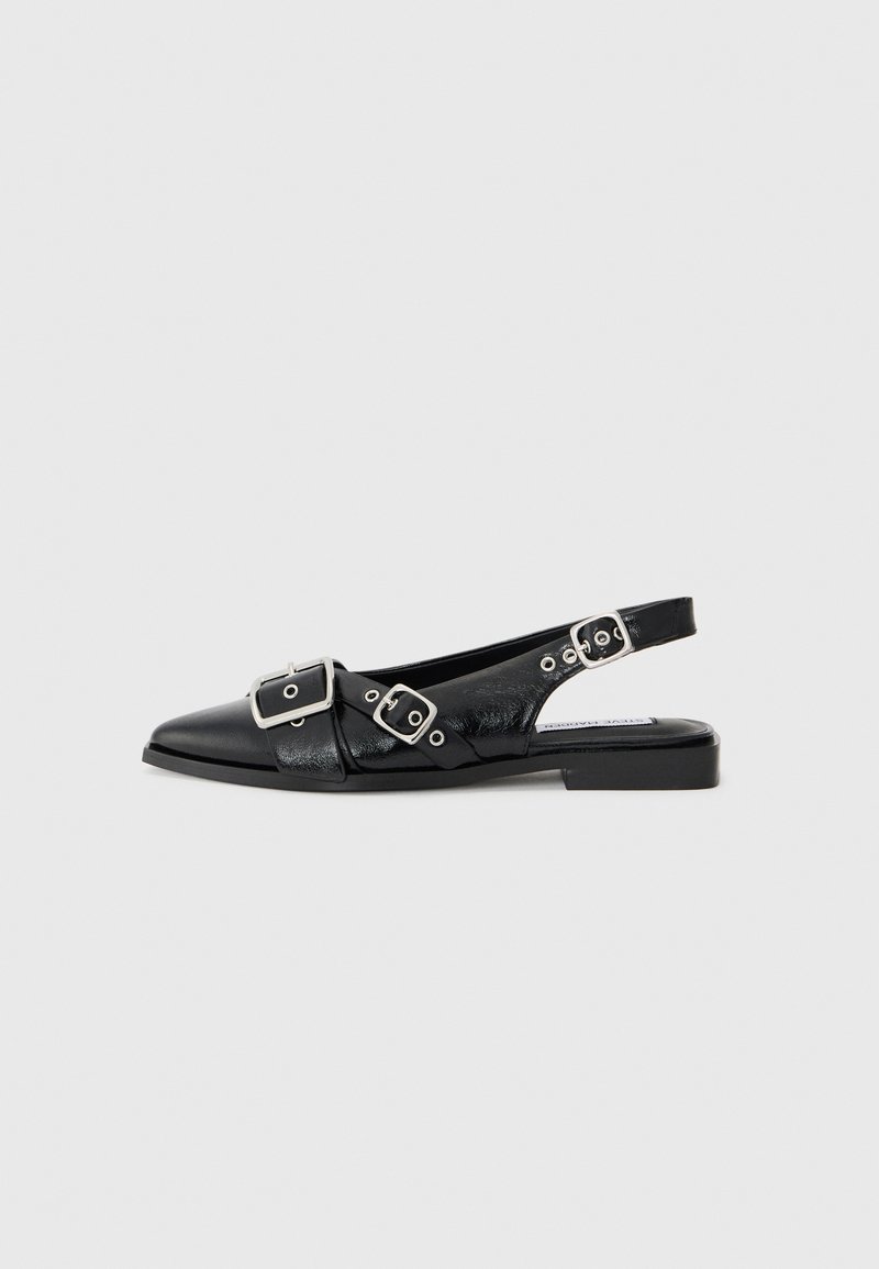 Black leather slingback shoe with a pointed toe, two silver buckles, and a low block heel. Features a textured upper and open back.