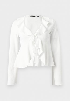 Λευκό μπλούζα με μακριά μανίκια, σούρες στον λαιμό και δεσία μπροστά, ελαφρώς υφασμάτινη υφή, εφαρμοστό στην μέση και φαρδύ τελείωμα.