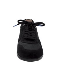 Black suede sneaker with textured side panels, rubber sole, and flat laces. Features metal eyelets and a contrasting blue lace tip.