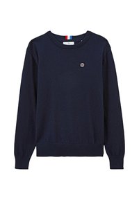 Pull marine bleu à manches longues, avec un ourlet et des poignets côtelés, un col rond et un petit logo circulaire sur la poitrine. Texture en tricot douce.