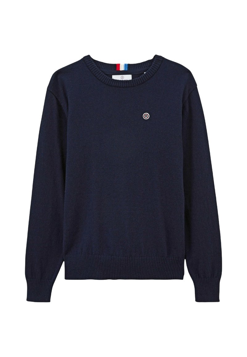 Pull marine bleu à manches longues, avec un ourlet et des poignets côtelés, un col rond et un petit logo circulaire sur la poitrine. Texture en tricot douce.