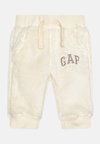 COZY LOGO PANT NEWBORN UNISEX - Auduma bikses - beige