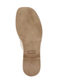 Light-colored shoe sole featuring a textured pattern, with a flat base and a slightly raised heel. Size marked as 37.