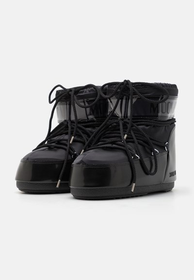 Black waterproof ankle boots featuring a glossy exterior, rounded toe, contrasting textured accents, and black laces.
