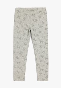 Grå leggings med et tekstureret mønster af subtile sløjfer og hjerter, lavet af strækbart stof, med et behageligt, tætsiddende design.