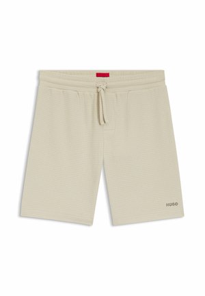 Beige Waffel-Strickshorts mit Kordelzugbund und Seitentaschen, mit kleinem "HUGO"-Logo am unteren rechten Bein.