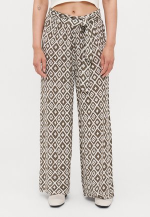 Wide-leg pants made of a lightweight, patterned fabric featuring an intricate diamond design in brown and white, with a tied waistband.