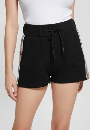 MIT SEITENSTREIFEN - Tracksuit bottoms - schwarz