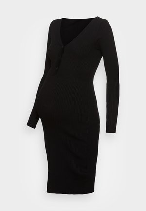 Zwarte ribbels zwangerschapsjurk met lange mouwen, V-hals, knoopdetail en midi-lengte. Gemaakt van een gestructureerd, rekbaar materiaal.