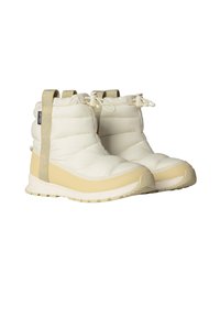 Valged ja heledat beeži tooni isoleeritud pahkluu saapad, mille pealmine osa on täpilise kangaga, kummist tallaga ja reguleeritavate nööridega kindlalt seljas hoidmiseks.