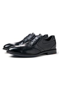 Schwarze Leder-derby-Schuhe mit glatter Oberfläche, spitzer Zehenform und dezenten Nähten. Verfügt über eine Schnürung und eine strapazierfähige Sohle.