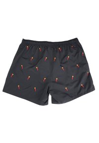 Pantaloni da bagno neri con cintura elastica, caratterizzati da ricami di peperoncini rossi e gialli sparsi su tutta la superficie.