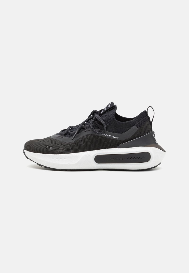 Black athletic shoe with a breathable mesh upper, cushioned white sole, textured detailing, and black laces. Features a pull tab at the back.
