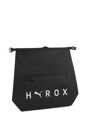 Schwarze wasserdichte Tasche mit schwarzer Reißverschlusstasche und weißem Puma-Logo sowie "HOROX" Text auf der Vorderseite.