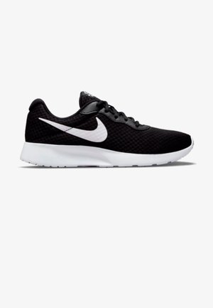 Chaussure de course Nike noire avec logo swoosh blanc et semelle blanche, affichée en vue latérale sur fond blanc.