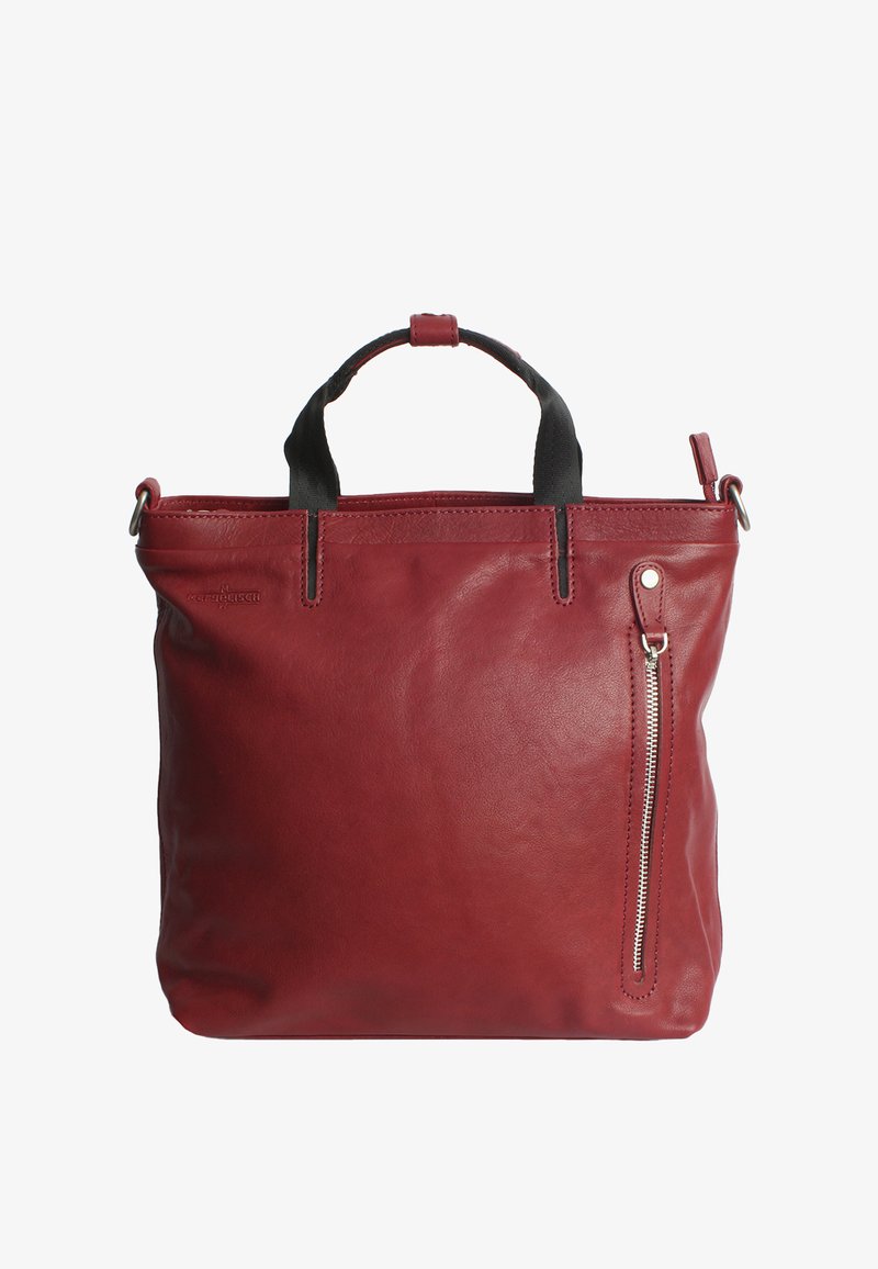 Red leather tote bag with dual top handles, zip closure, and a side pocket. Smooth texture with minimalist design and contrast black accents.