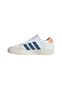 White sneaker with textured synthetic material, blue stripes, and orange heel accent. Rounded toe and rubber sole for grip.