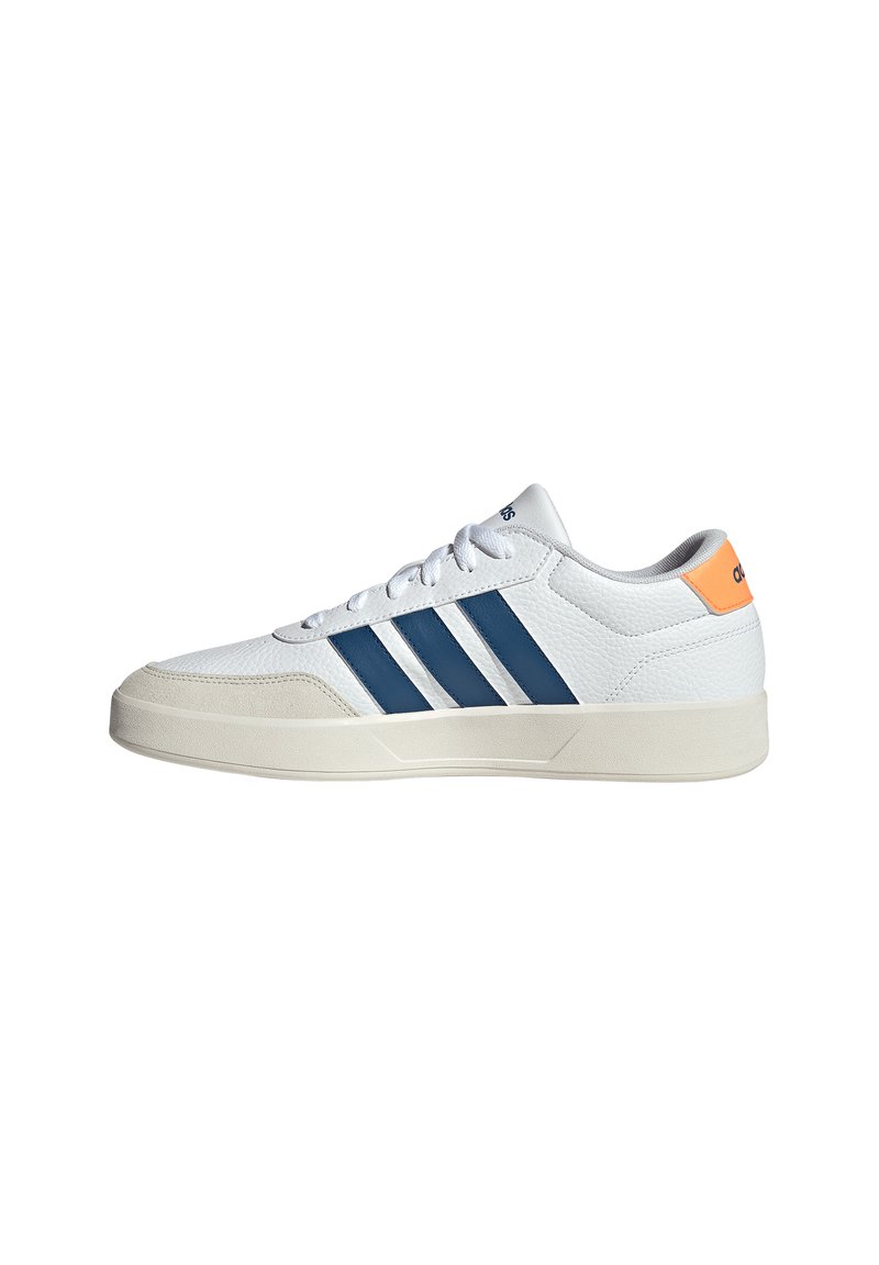 White sneaker with textured synthetic material, blue stripes, and orange heel accent. Rounded toe and rubber sole for grip.