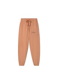 Peach-colored jogger pants with an elastic waistband, drawstring, side pockets, and subtle logo detail on the left leg.