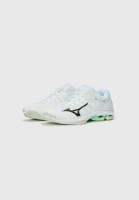 Lightweight running shoes in white mesh, featuring black logo, mint green sole accents, and multi-color laces. Rounded toe and breathable design.