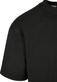 Black short-sleeve t-shirt with a round neckline, made of smooth cotton fabric, featuring a clean, unadorned design.
